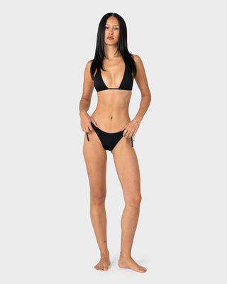 Woman wearing Cedar Midi Side Ties Bikini Bottom in Black