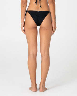 Woman wearing Cedar Midi Side Ties Bikini Bottom in Black