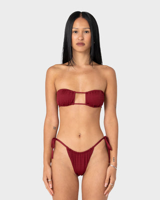 Woman wearing Cedar Bandeau Open Front Bikini Top in Cranberry