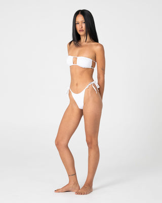 Woman wearing Cedar Bandeau Open Front Bikini Top in White