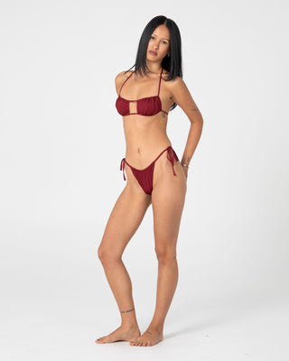 woman-wearing-cedar-cheeky-side-ties-bikini-bottom-in-cranberry