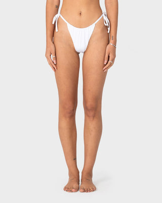 woman-wearing-cedar-cheeky-side-ties-bikini-bottom-in-white
