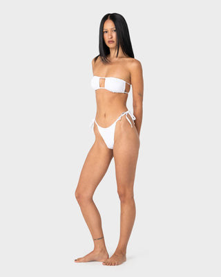 Woman wearing Cedar Cheeky Side Ties Bikini Bottom in White