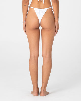 Woman wearing Cedar Cheeky Side Ties Bikini Bottom in White