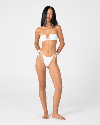 Woman wearing Cedar Cheeky Side Ties Bikini Bottom in White