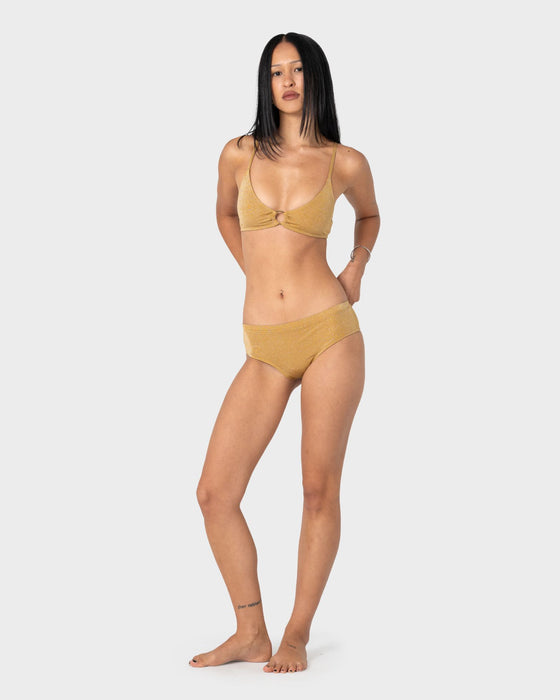 woman-wearing-shimmy-cheeky-bikini-short-in-gold