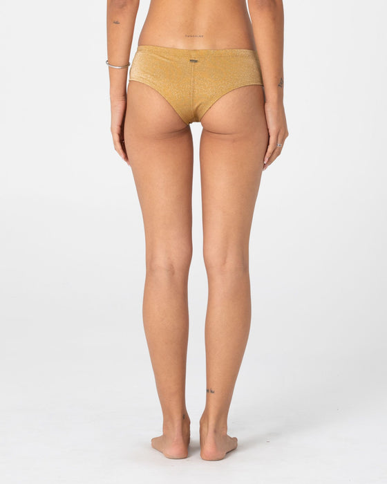 woman-wearing-shimmy-cheeky-bikini-short-in-gold