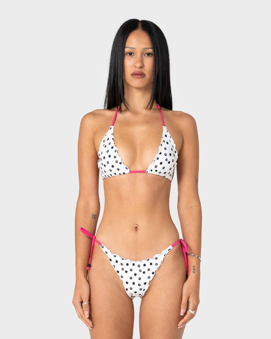 woman-wearing-miss-dot-tri-bikini-top-in-cream-black-r-dot