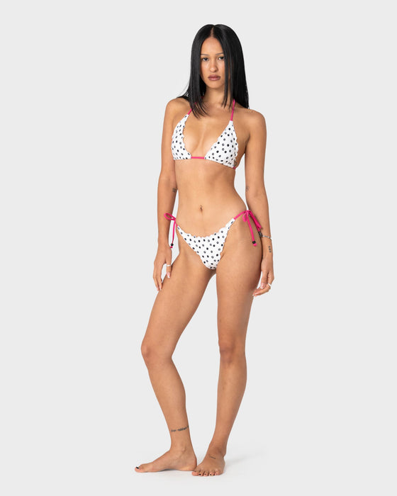 woman-wearing-miss-dot-tri-bikini-top-in-cream-black-r-dot