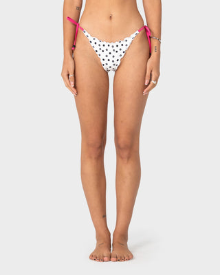 Woman wearing Miss Dot Brazilian Bikini Bottom in Cream / Black R Dot