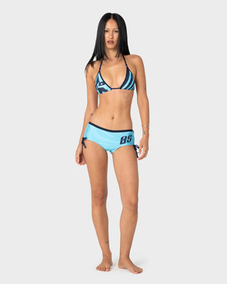 Woman wearing Stardom Booty Bikini Bottom in Navy / Aqua