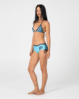 Woman wearing Stardom Booty Bikini Bottom in Navy / Aqua