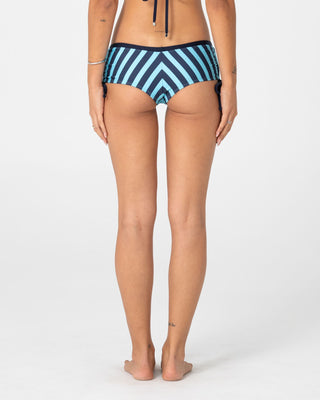 Woman wearing Stardom Booty Bikini Bottom in Navy / Aqua