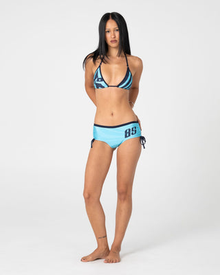 Woman wearing Stardom Booty Bikini Bottom in Navy / Aqua