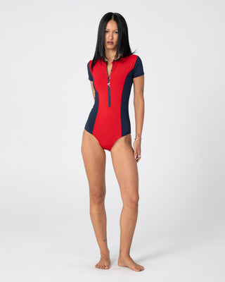 Woman wearing Dirt Rider S/S Surf Suit in Red / Navy