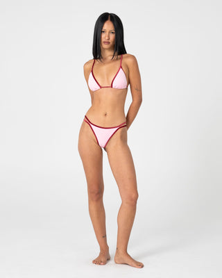 Woman wearing Sugary Sliding Tri Bikini Top in Pink / Red