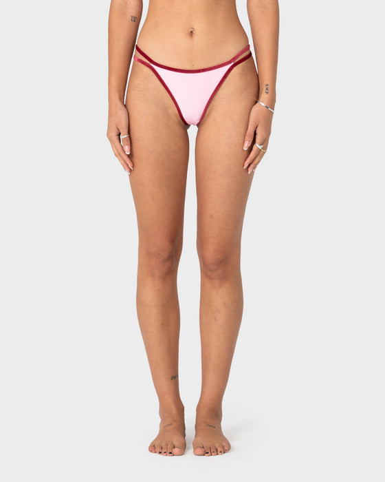 woman-wearing-sugary-brazilian-bikini-bottom-in-pink-red