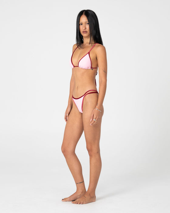 woman-wearing-sugary-brazilian-bikini-bottom-in-pink-red
