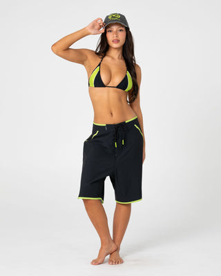 Woman wearing Voltron Tri Bikini Top in Black / Lime
