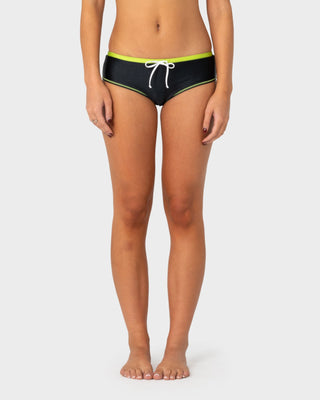 Woman wearing Voltron Booty Bikini Bottom in Black / Lime