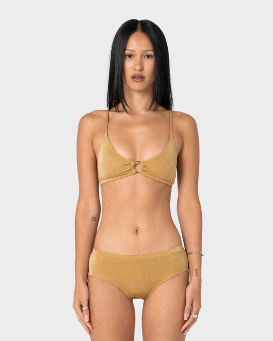 woman-wearing-shimmy-scoop-bikini-top-in-gold