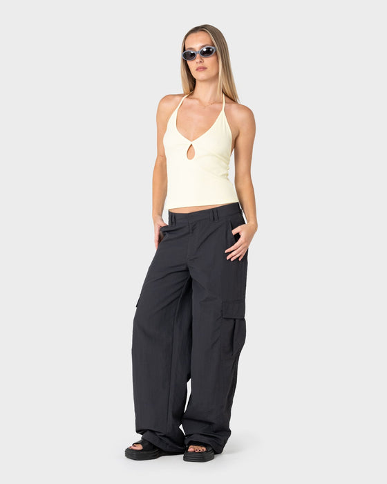 woman-wearing-emma-cut-out-skimmer-tank-in-pale-banana