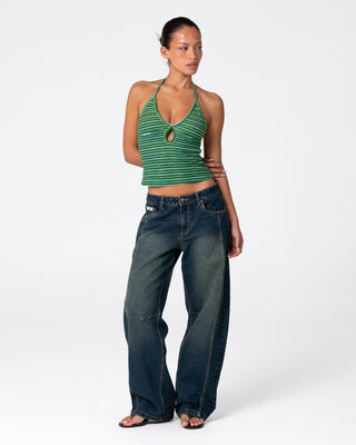 Woman wearing Emma Cut Out Skimmer Tank in Tonal Green Stripe