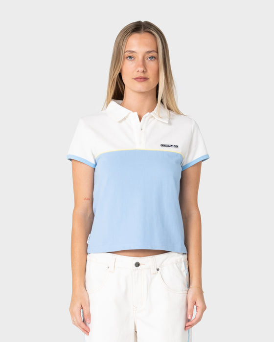 woman-wearing-insert-dad-joke-baby-polo-tee-in-retro-blue-white