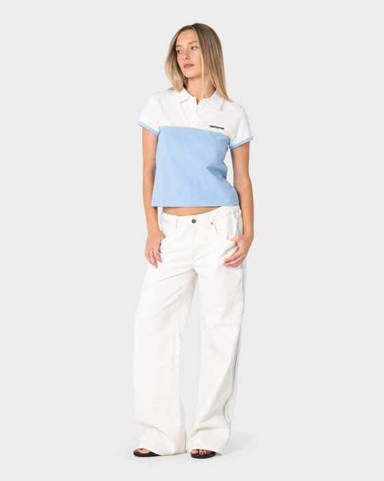 woman-wearing-insert-dad-joke-baby-polo-tee-in-retro-blue-white