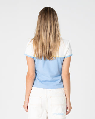Woman wearing Insert Dad Joke Baby Polo Tee in Retro Blue / White