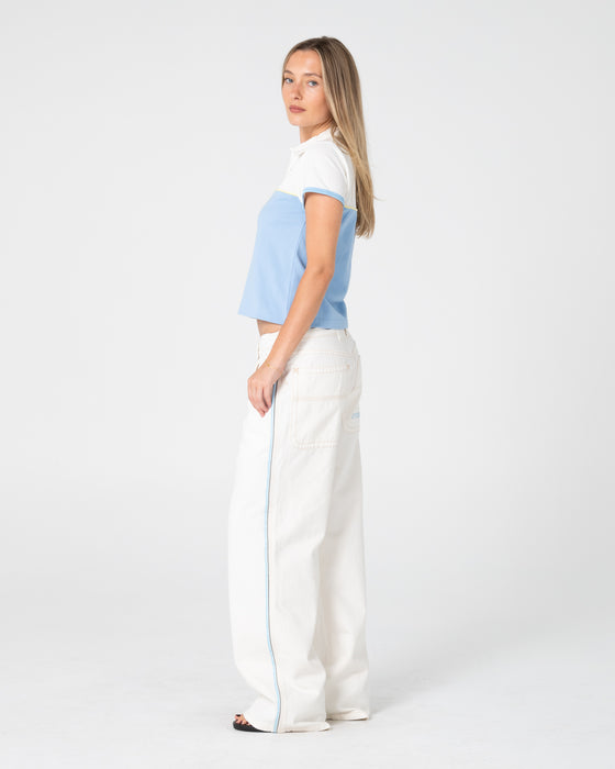 woman-wearing-insert-dad-joke-baby-polo-tee-in-retro-blue-white