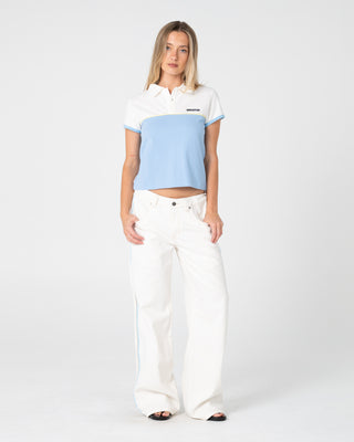 woman-wearing-insert-dad-joke-baby-polo-tee-in-retro-blue-white
