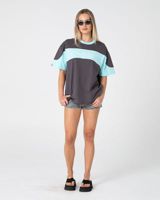 Woman wearing Kinetic Oversize Tee in Carbon / Aqua