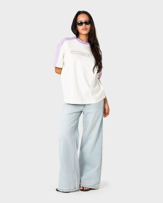 Woman wearing Timmy Target 220 Oversize Tee in Cream / Mulberry Purple