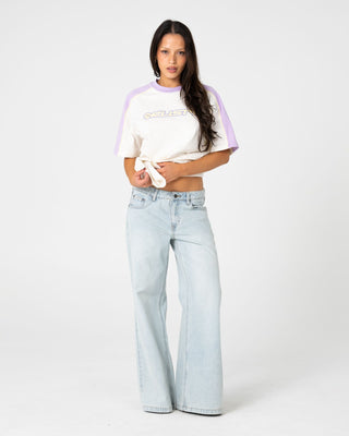 Woman wearing Timmy Target 220 Oversize Tee in Cream / Mulberry Purple