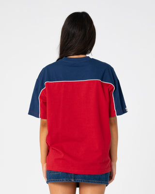 Woman wearing Archived Ops Oversize Short Sleeve Tee in Cranberry / Navy