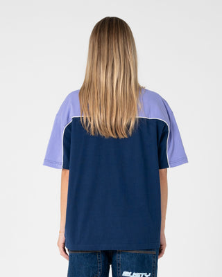Woman wearing Archived Ops Oversize Short Sleeve Tee in Navy / Mulberry Purple