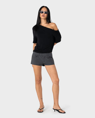Woman wearing Sally Slouch Off Shoulder Tee in Black