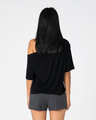 Woman wearing Sally Slouch Off Shoulder Tee in Black