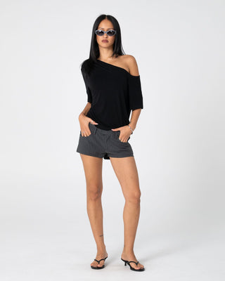 Woman wearing Sally Slouch Off Shoulder Tee in Black