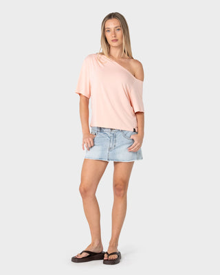 Woman wearing Sally Slouch Off Shoulder Tee in Peach Pink
