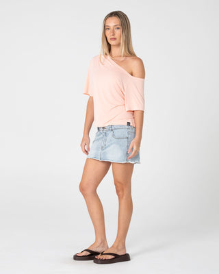Woman wearing Sally Slouch Off Shoulder Tee in Peach Pink