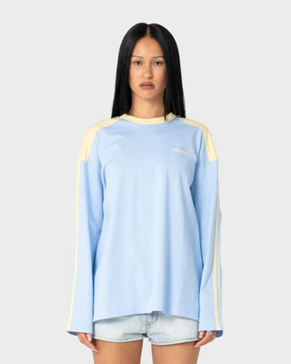 Woman wearing Penny Oversized Long Sleeve Tee in Retro Blue / Yellow Stripe