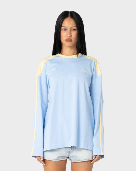 woman-wearing-penny-oversized-long-sleeve-tee-in-retro-blue-yellow-stripe
