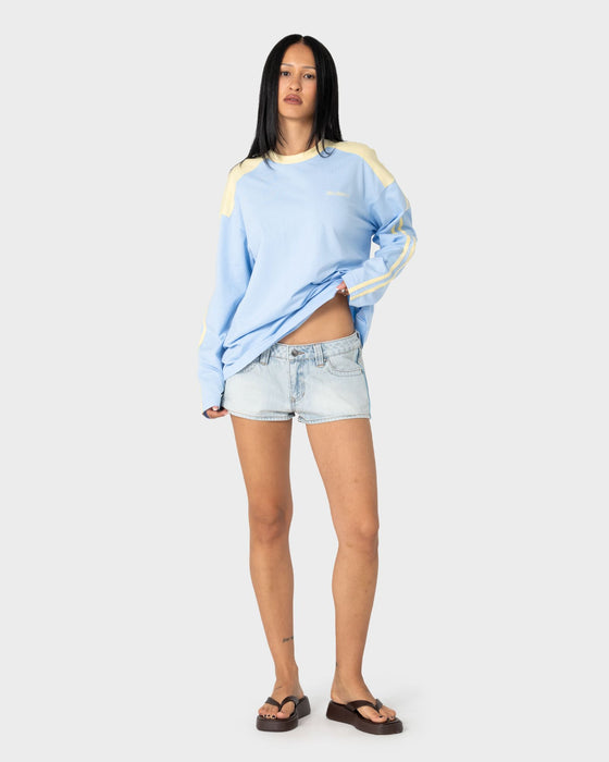 woman-wearing-penny-oversized-long-sleeve-tee-in-retro-blue-yellow-stripe