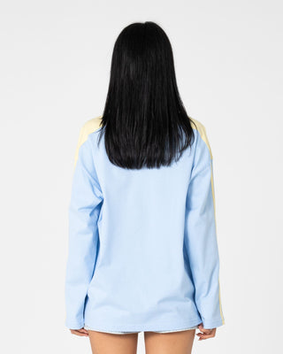 Woman wearing Penny Oversized Long Sleeve Tee in Retro Blue / Yellow Stripe