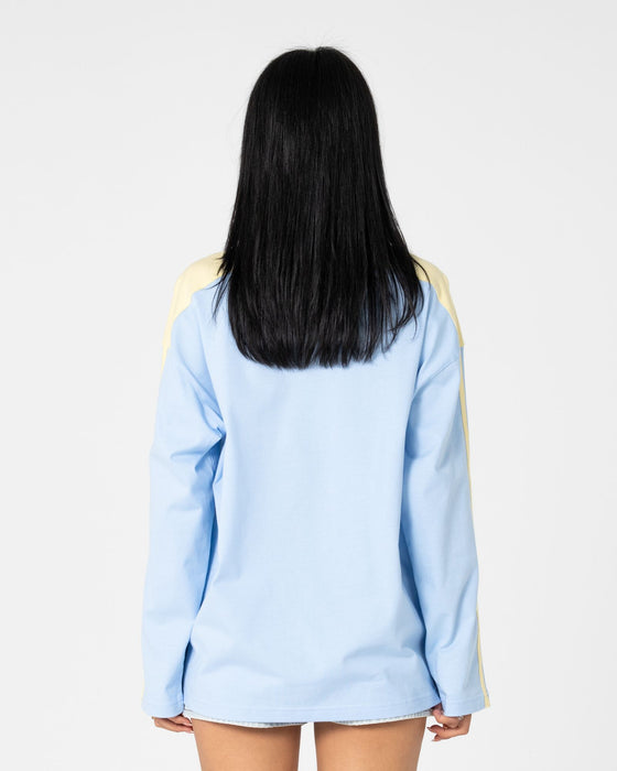 woman-wearing-penny-oversized-long-sleeve-tee-in-retro-blue-yellow-stripe