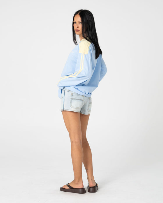 woman-wearing-penny-oversized-long-sleeve-tee-in-retro-blue-yellow-stripe