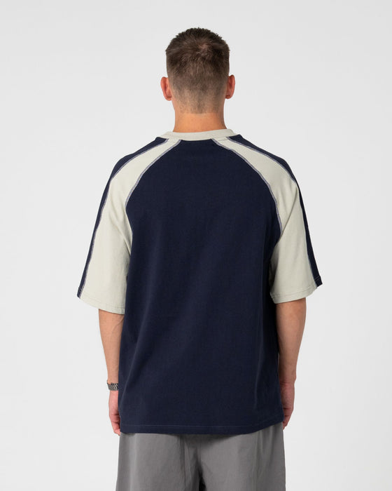 man-wearing-fade-r-short-sleeve-tee-in-navy-blue