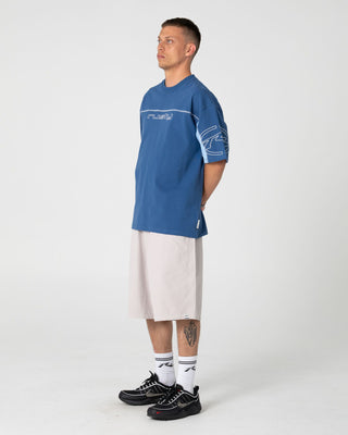 Man wearing Cyberwave Short Sleeve Tee in Atlantic Blue